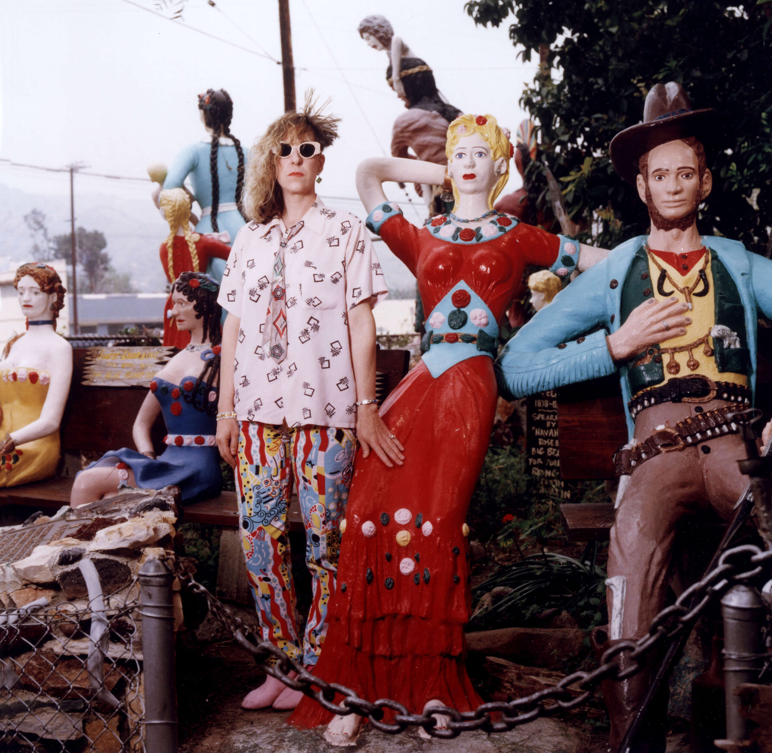 Songwriter, Allee Willis standing amongst mannequins.