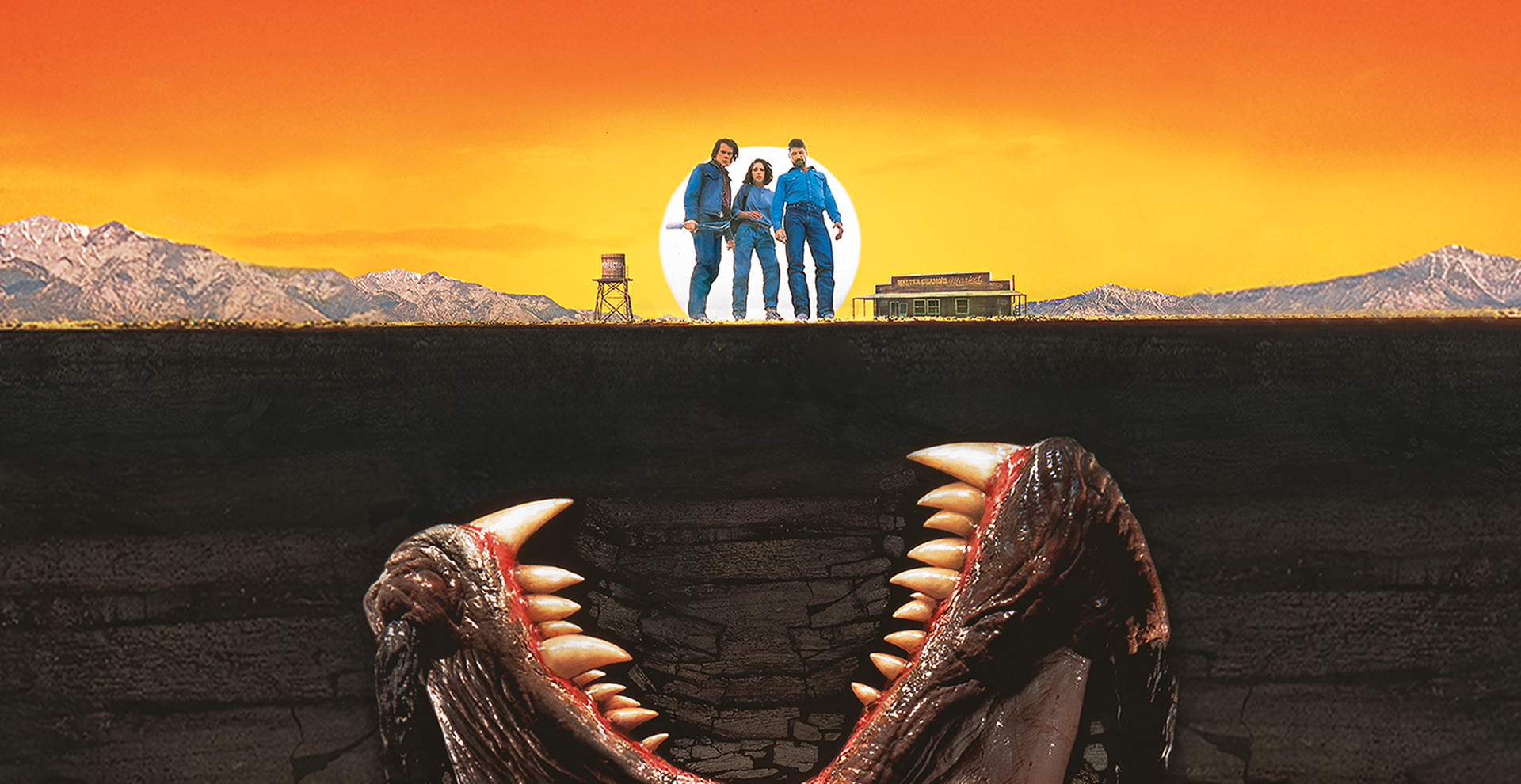 Giant open mouth of underground monster bearing its teeth at three people standing above ground.