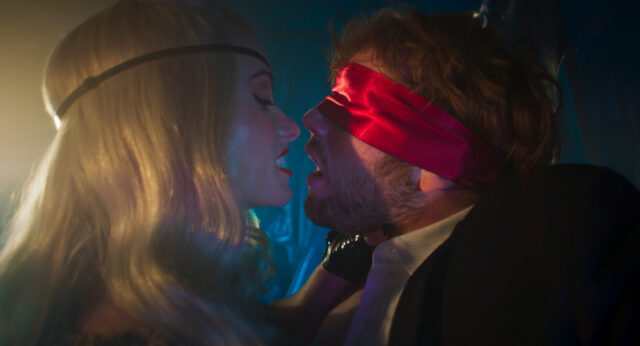 Cooper Hoffman and Olivia Wilde in a scene from I Want Your Sex