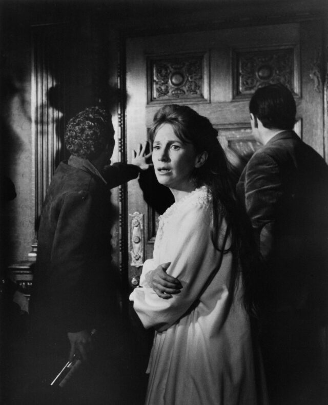 Russ Tamblin, Julie Harris, and Richard Johnson in a scene from The Haunting.