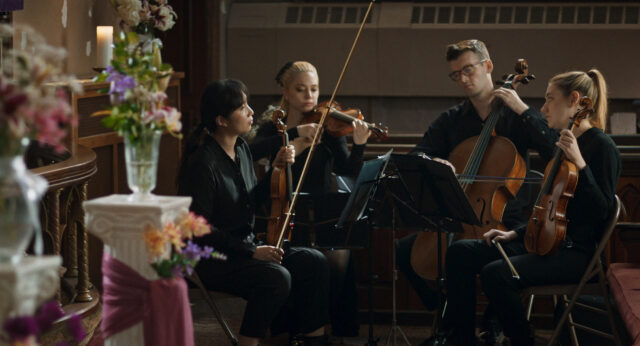 Isabel Hagen and cast in a scene from On A String.