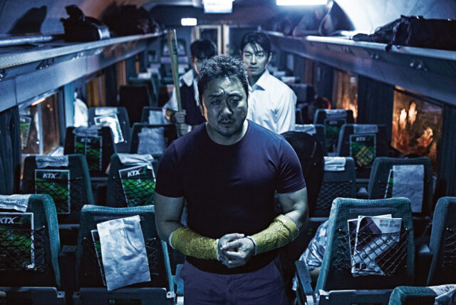 Ma Dong-seok and Gong Yoo in a scene from Train to Busan.