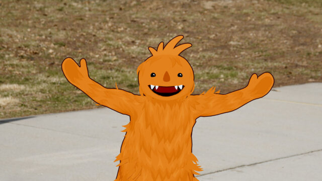 An animated orange monster holds out its arms in a scene from the short film Moster The Monster.