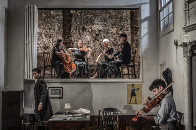 Josh O'Connor and musicians in a scene from National Theatre's Golden Boy.